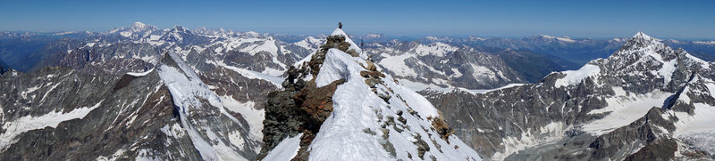 Matterhorn summit panorama west. Italian summit is in the center. Left: Dent d'Herens. Mont Blanc is in the background. Right: Dent Blanche.