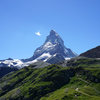 Hörnli Hut approach trail with Matterhorn towering above seen from Schwarzsee.