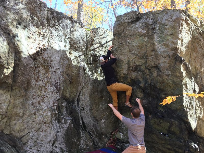 David balances up the arete of Warrior's Way (V2) at the Chief Block.