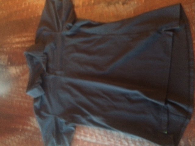 Arcetryx black mens lg polo. crappy picture I know. good shape no holes or stains sz lg. Green trim on inner hem. 20 shipped.