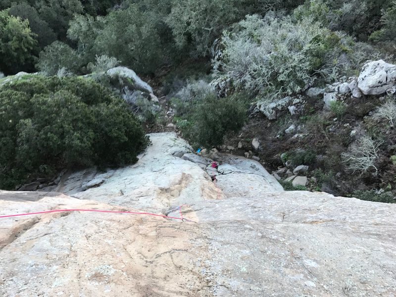 View to belay from top anchor showing route.