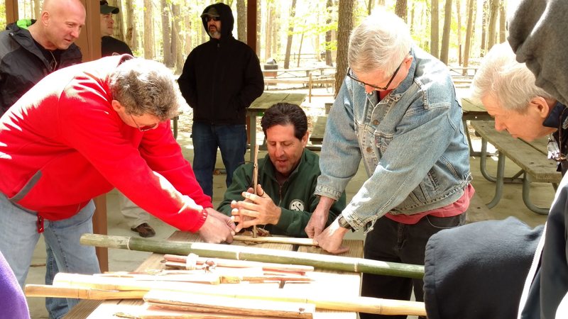 This photo is from one of my 2016 Quest For Fire Classes I give at Turkey Swamp Park for Monmouth County Parks Department. I am using a hand drill made from Hibiscus to make a friction fire. I am using thumb thongs to increase the downward pressure which raises the frictional coefficient exponentially. 