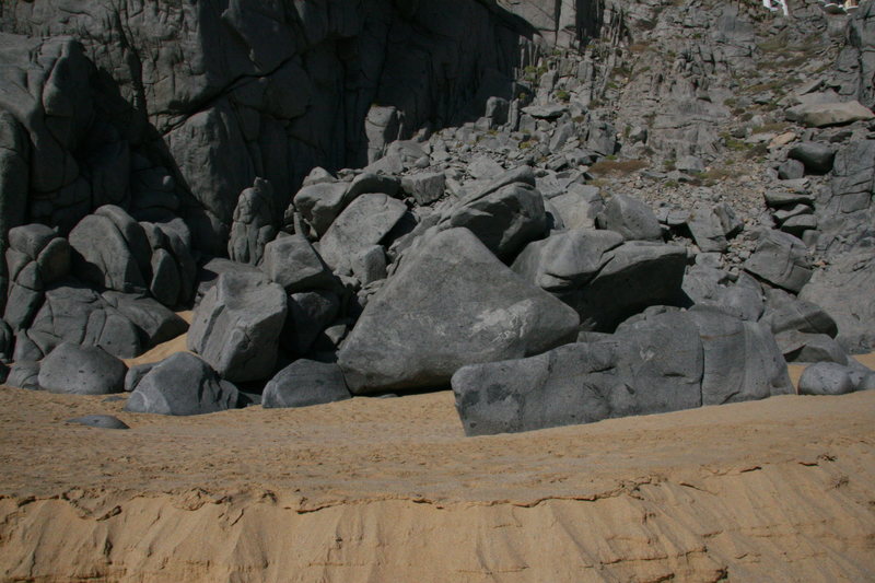 The boulders where the small roof is located. Roof is seen on the right of photo.