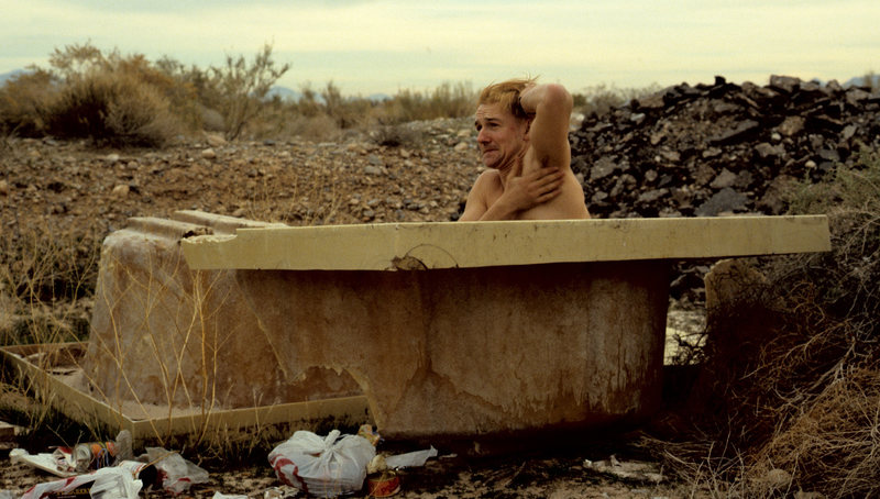 Somewhere outside of Vegas- arriving in the wee hours from Ventura we found a quiet bivvy spot. Turned out it was an old dump. Craig Smith taking advantage of the amenities. Circa 1988.