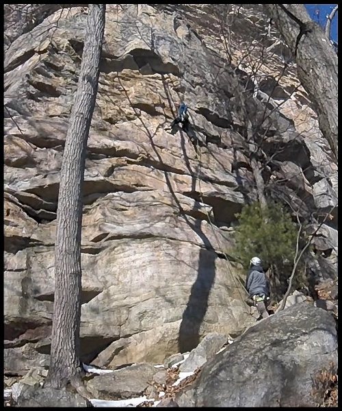 Chalking up before getting into the crux.