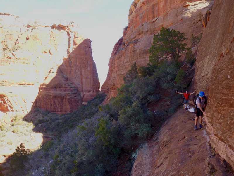 Nate and Alexis walking the limestone ledge. Photo taken from tunnel entrance.