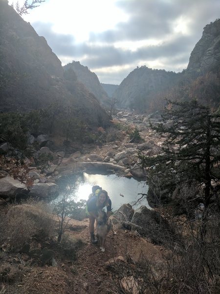 Looking down through the narrows from the approach trail. This trail ends at the pool visible in this picture where you have to cross and continue on left side of the creek bank.