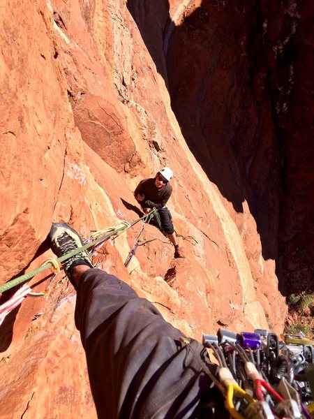 Starting the second pitch, looking down at Ray on belay.