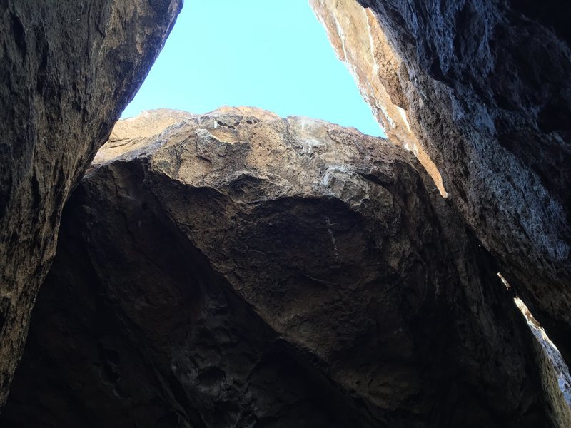 Climb out to the daylight through this sloping topout.