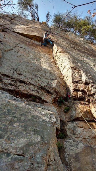 Thin 5.9 finger crack to the crux, where I am placing a #0 Metolius TCU. It perfectly protects the crux move. You can also place something below the roof if you want.
