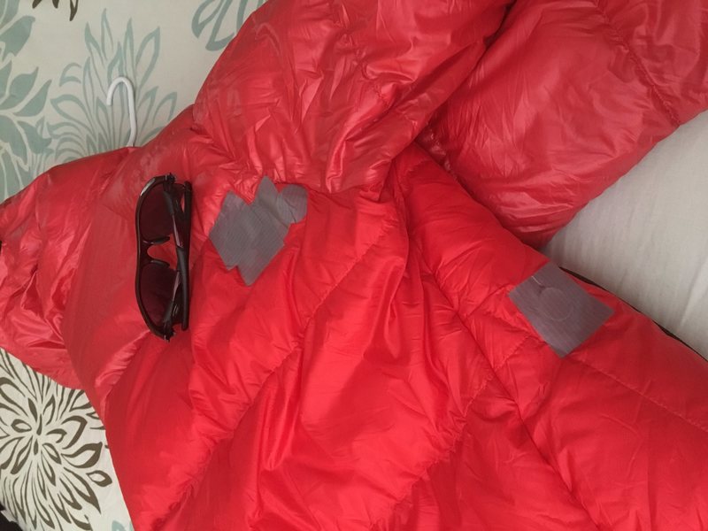 Ran into a lantern high on a mountain. Patched immediately. No down lost at all. Jacket used about 5 times total