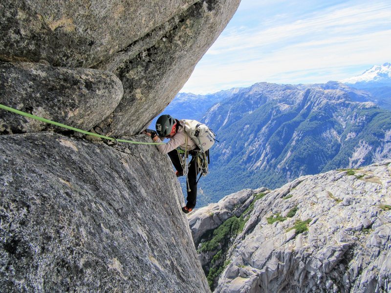 Natalie Brechtel turning the airy arete into the cave belay on EZ Does It, Cerro Trinidad