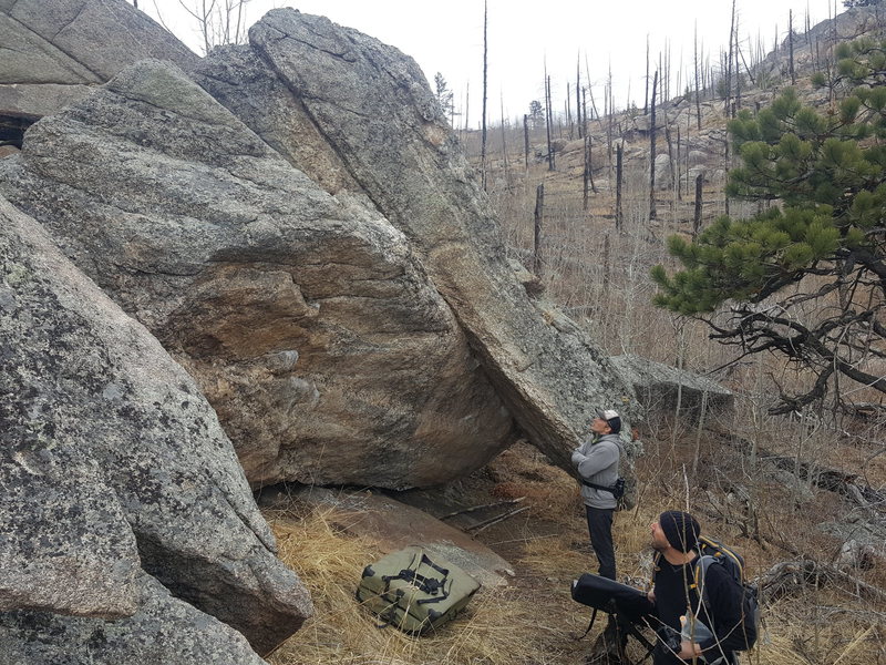Climbing in Choss Roof Boulder, Lyons
