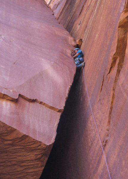 Exiting the flare traverse and continuing on with the last little bit of easy/moderate OW. I brought a tag line in case the 60m didn't reach the ground. It does, provided you belay your second from the top. The rappel lands you 20' higher than the start of the route.