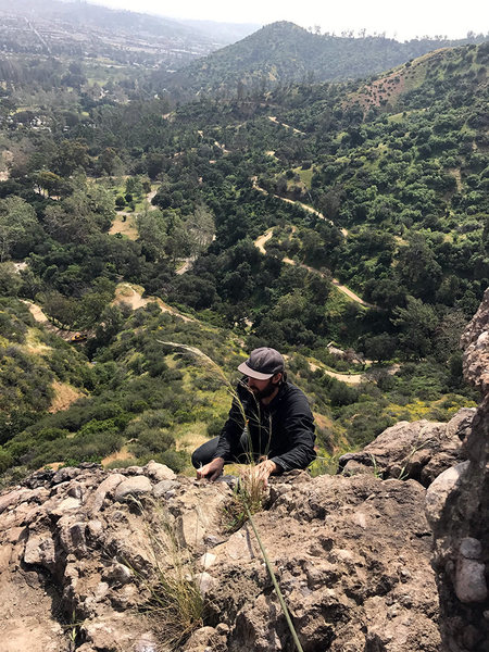 James pulling over the lip of pitch 2