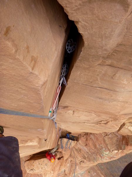 Looking down the offwidth on P2 from just below the roof. Dave on belay below. Tag line illustrates the steepness.