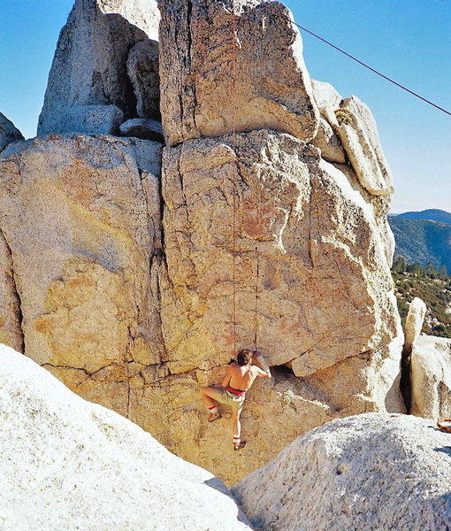Paul Gleason on the steep 5.10 crimpers on the north side of main rock, 1986. Don Hunter photo.