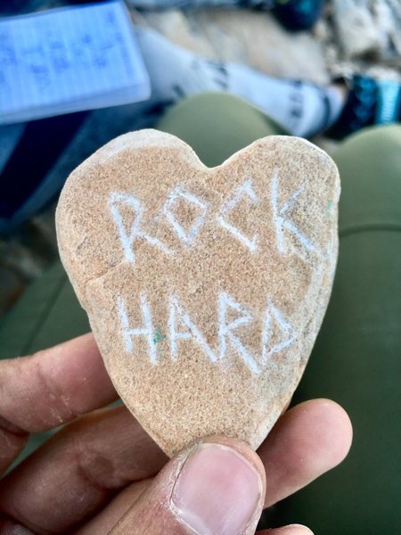 At the top found a notebook with handwritten names & messages from climbers that made it there before, a polaroid picture, and this cool rock.