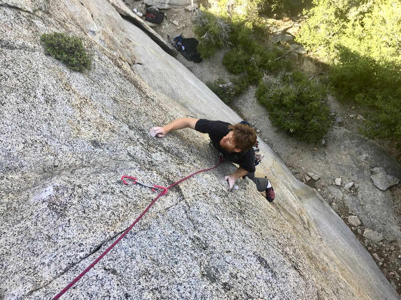 Pulling over the roof. You don't get the bolt until after the crux, but the gear below is good.
