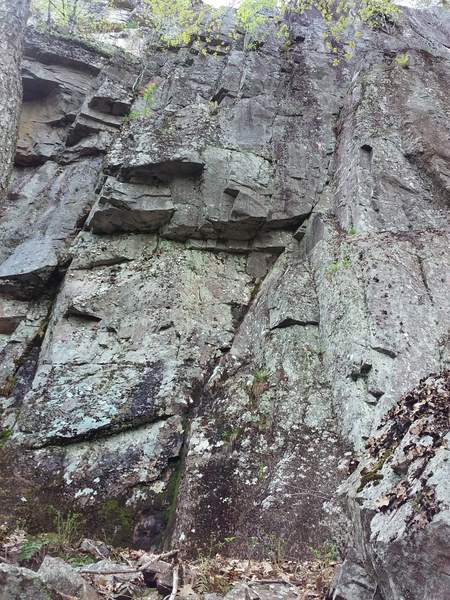 I think the slanting ramp in the middle here is "For Dear Life" (5.4) at Cemetery Cliff. The lichen doesn't bother me, but TBH, the whole area looks rather chossy.