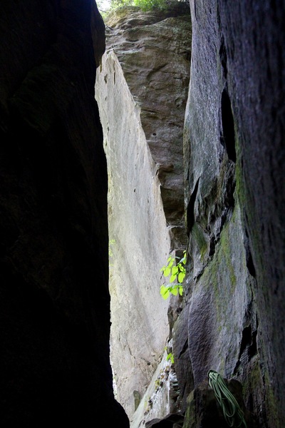 A look through the corridor at the striking arête of Pay the Devil, 5.13b