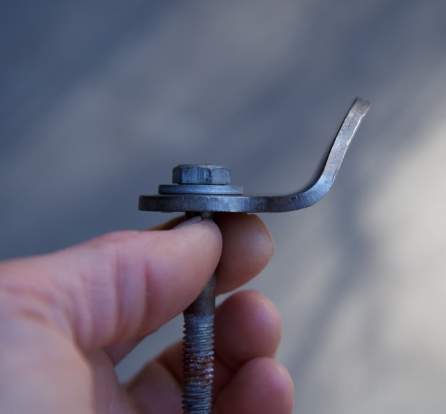 Removed this bolt and hanger from the crux and replaced it with a new 1/2" bolt and hanger awhile back. Check out the bend in the old hanger.