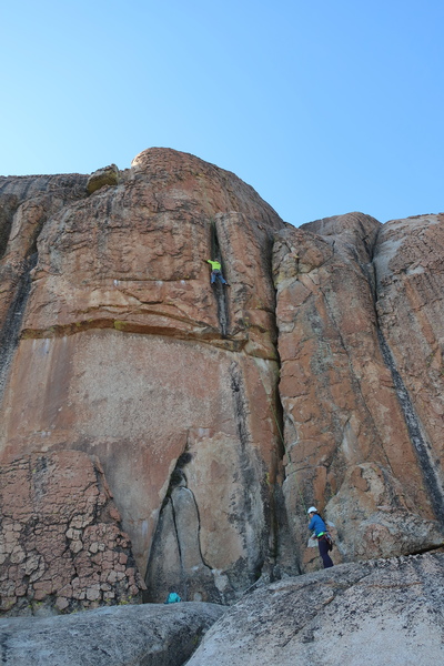 Past the roof, heading up the shallow chimney on Don't Take It For Granite