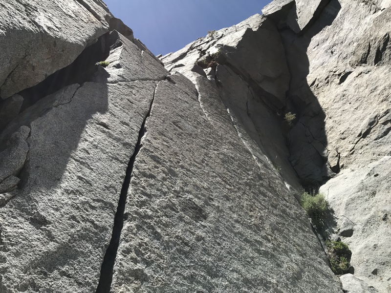 Upper half of pitch 3 climbs the face in the upper photo