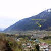 Here you can see the wall from afar. Manali is further up the valley towards where the photo generally aims. You can also see the scattered houses that sit below the rock face.