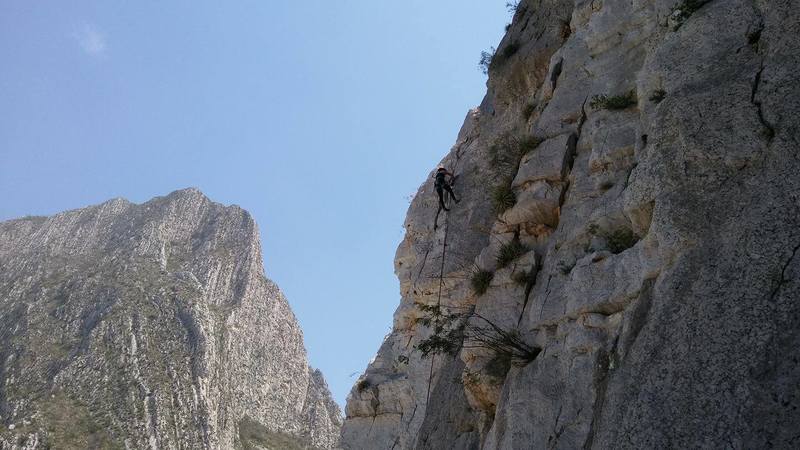 Elizabeth Rubio cleaning the route at the top