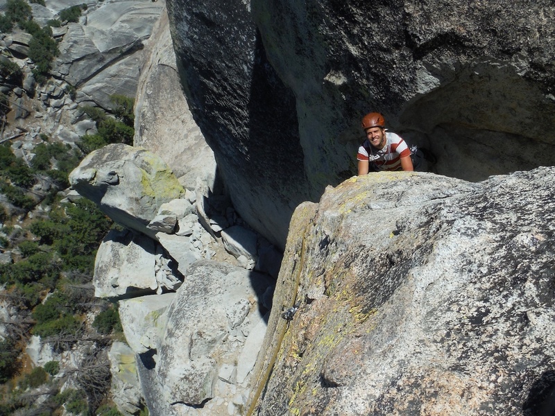 Pitch 4. The final bit to the summit is up an exposed arete. There are two options: a 2-bolt way further out on the arete (easier) or a 3-bolt way more back on the face (harder). This shows Danny on the 2-bolt way.