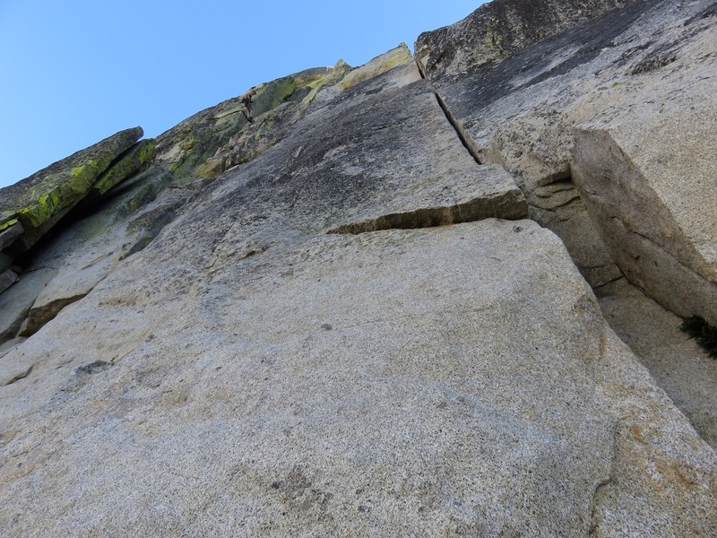 There are two ways to do the first pitch of The Howling: either the crack system on the left that the climber is rappelling in the photo or the splitter on the right.