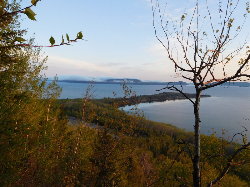 Cold air coming from the south across Gitchigumi condensing over the outer islands of Kama Bay to form rolling clouds over the warm rock. what a lovely evening that was.