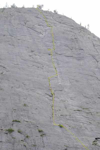 This shot shows all but the first 1.5 pitches of the Regular Route. Location of the two bolt belay might not be spot on, but they're up there somewhere.