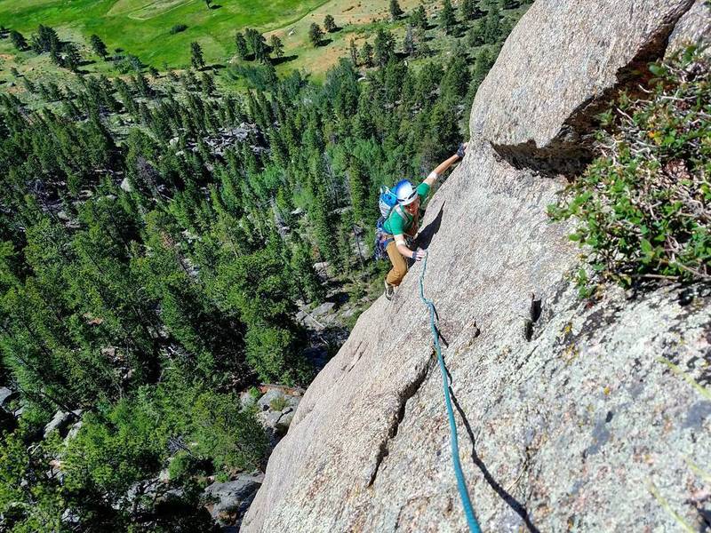 Harrison on the slab traverse. I linked the P1 dihedral and the P2 5.9 crack / slab. Belayed at base of chimney because I was out of larger gear.