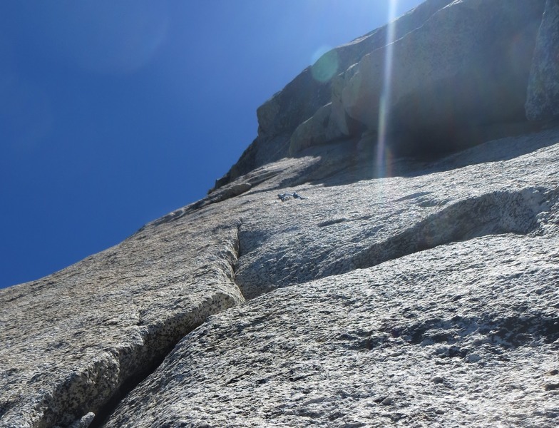 This fixed piton and the dihedral to the right is Fingergrip (5.8). Instead, go left after the 5.3 layback pitch (P3) to get to the fingertip traverse.