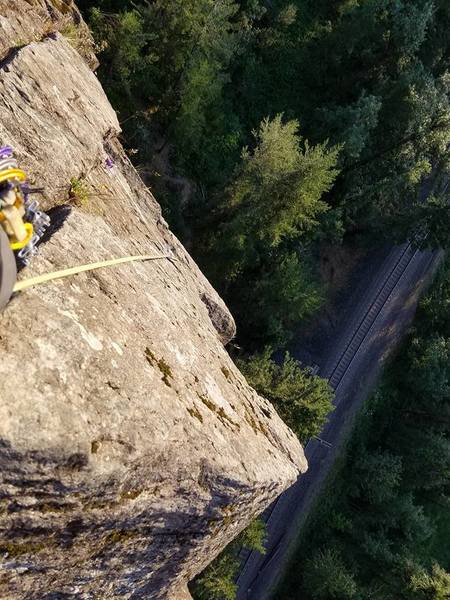 Just getting to belay ledge with tree at top of pitch 3, what great exposure for the grade!