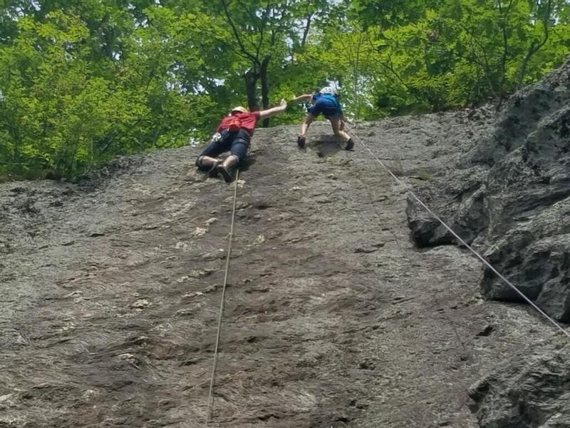 Cleaning Boltline while high-fiving a prety rad kid who was climbing the unbolted face next to me.