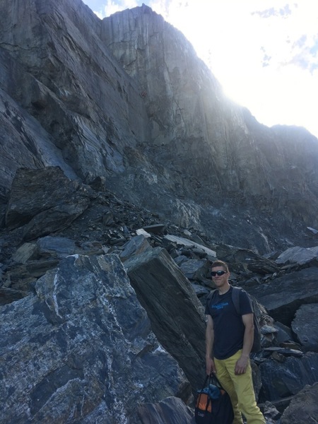 Pat walking back on the new approach Trail after a day of climbing at the Sunnyside and Republic. Nick and Dalton are climbing a new trade route in the background on the Worthington main buttress