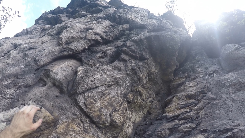 Climb straight up obvious V feature after pulling roof (mind the last rock as it is both dirty on top and likely loose!) ... There are some hidden hand holds which still make this section a little sketchy ;)