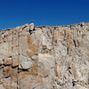 scrambler on summit of Keeler Needle,<br>
with Mt Whitney summit and its building behind right