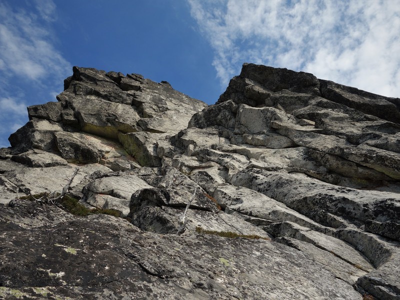 View of the 3rd pitch. We climbed up towards the straight splitter crack in the center of the photo (looks very small from here), passing a piton on our left, before traversing left into the notch.