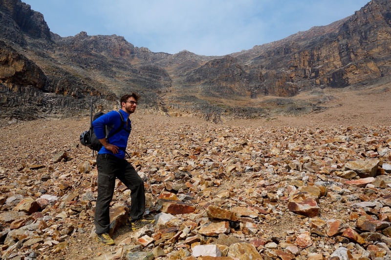 This photo was taken on the descent via the West Ridge route, which came down the ledges and talus behind and just right of Rob's head in the photo.