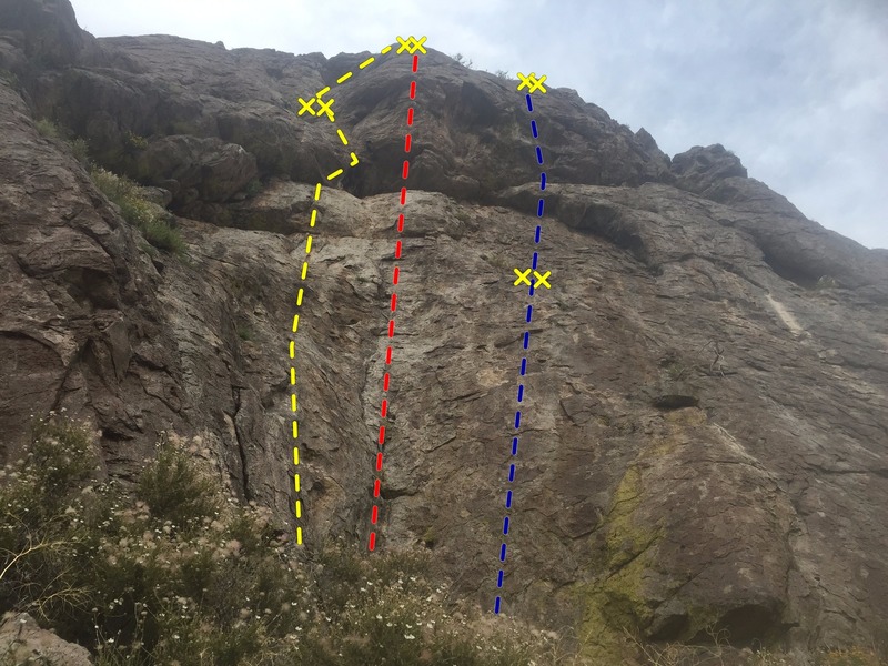 The middle of the Lefty Wall. Routes left to right Winter Surprise (5.10a), red (5.11d), and blue (5.11c). You need an 80m to get down in one pitch.