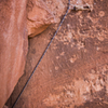The last bolt that keeps the rope from getting sucked in (and destroyed) behind the solid block right before the anchors. Fold a sling over six or seven times and it'll keep your rope happy. Enjoy!