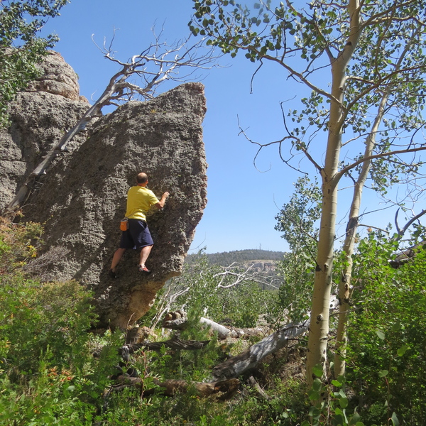 Chris Smith on a fun V0 highball just to the right. carefully scramble off left to descend.
