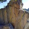The north face of Works Rock, Crafts Peak<br>
<br>
A. Work Needed (5.10a)<br>
B. Highway to Hell (5.11c)