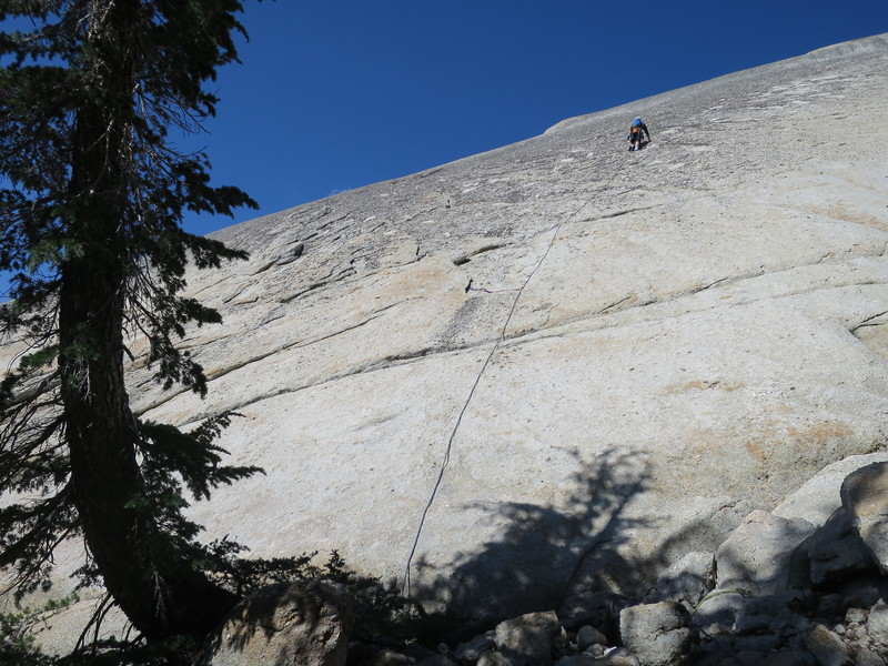 Vlada Matena clipping the first bolt on Pitch 1 (the bolt is hard to spot from the ground).