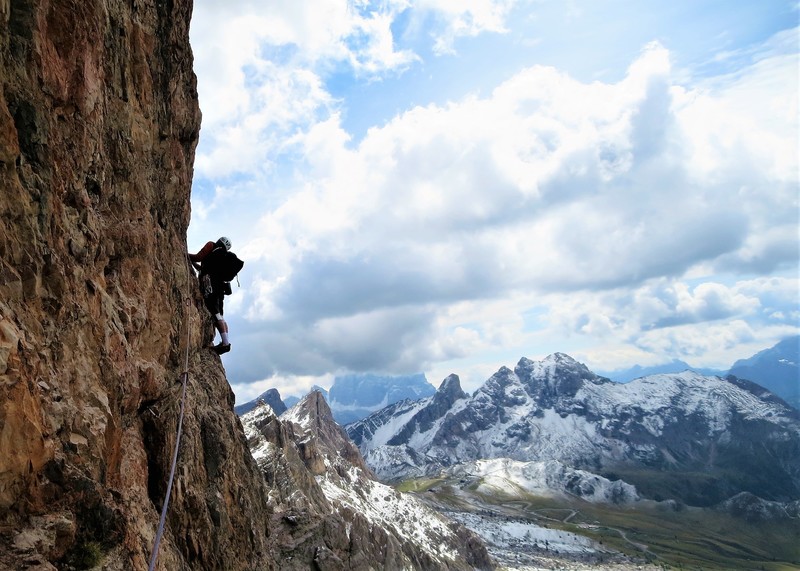 Kim Miller (RKM) on the crux traverse with a cloud shrouded Monte Pelmo as backdrop.