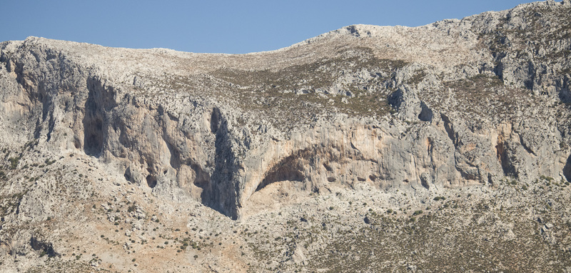 Panorama of many of the popular walls above Masouri, with the Grande Grotta the huge cave right in the middle